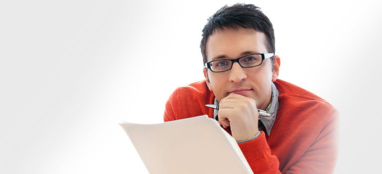 Businessman reviewing report in office